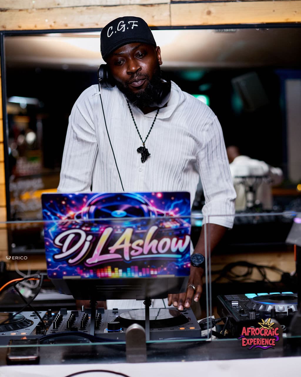DJ mixing music at an Afrocraic event